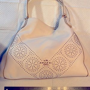 Chalk White large Coach purse with mostly yellow gold accents.